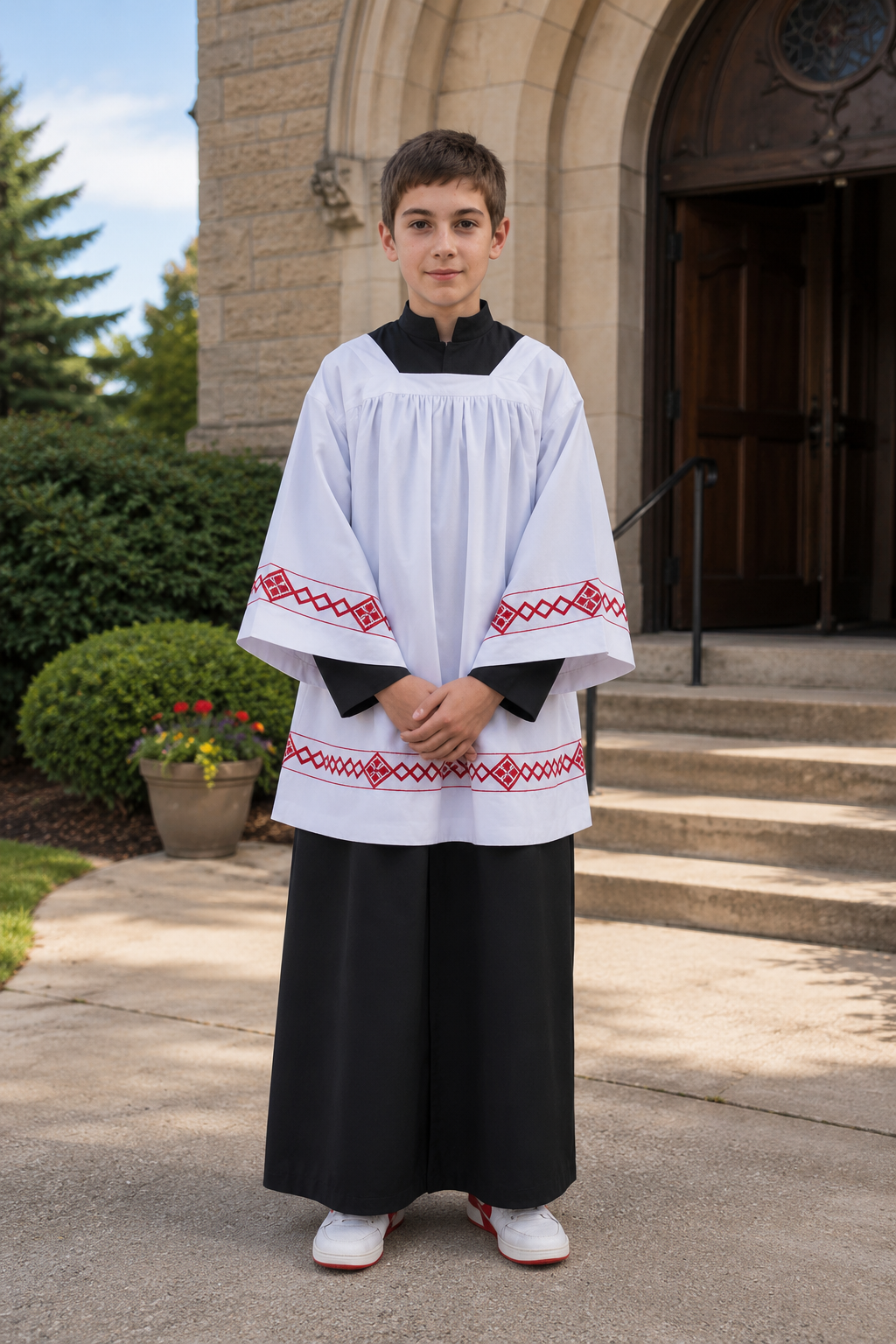Altar server surplice with black trim and a black cassock alb.