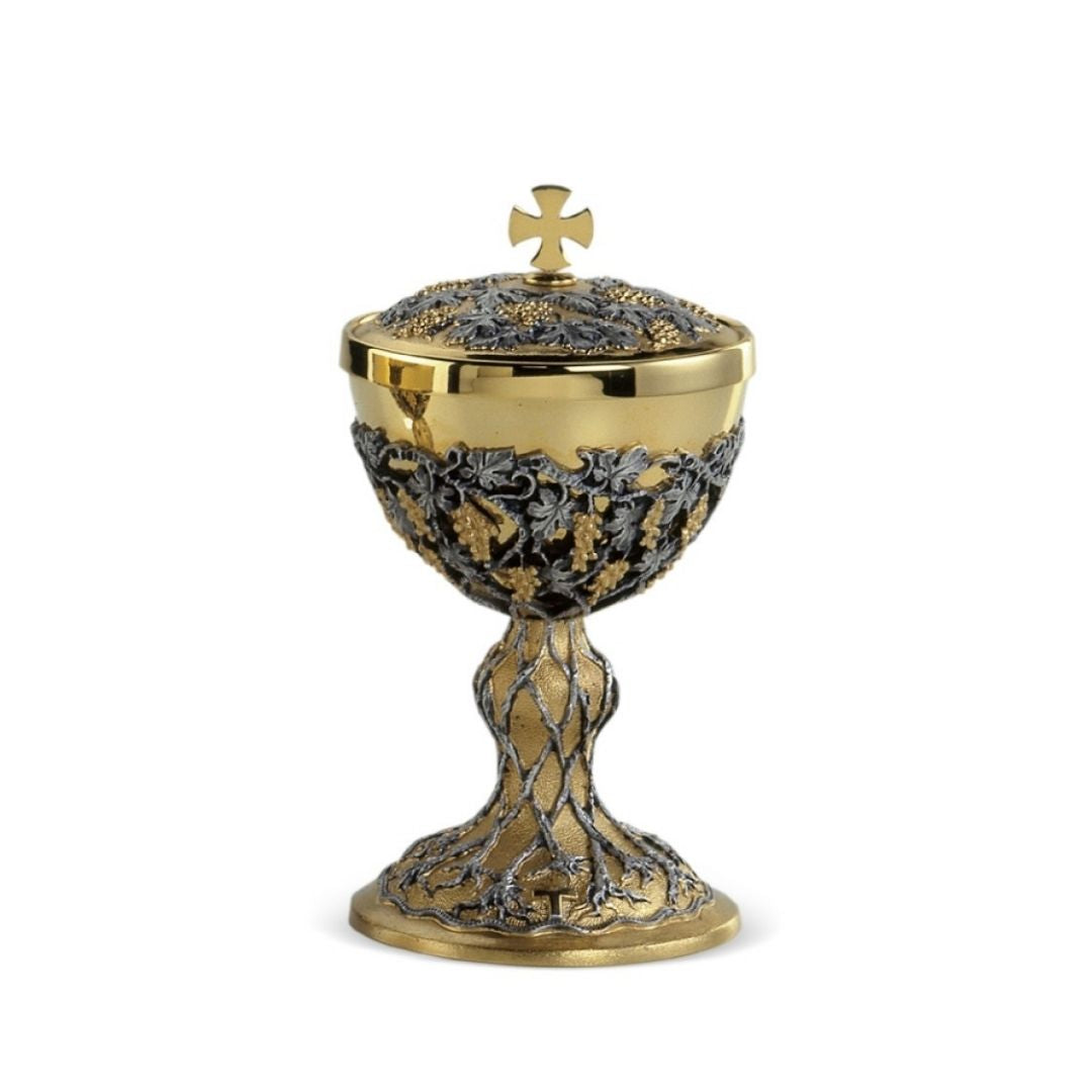 Ciborium with intricate hand chiseled filigree two tone silver and gold vines and grapes by Desta Italy and sold by The Clergy Store