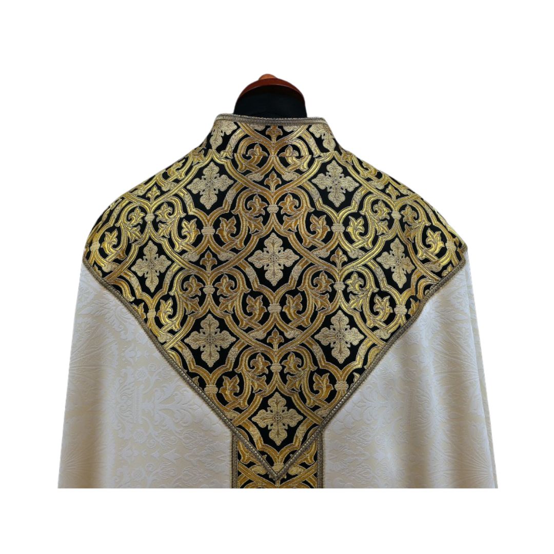 Liturgical cope made with black and gold brocade on ivory damask. Made in Poland and sold by The Clergy Store