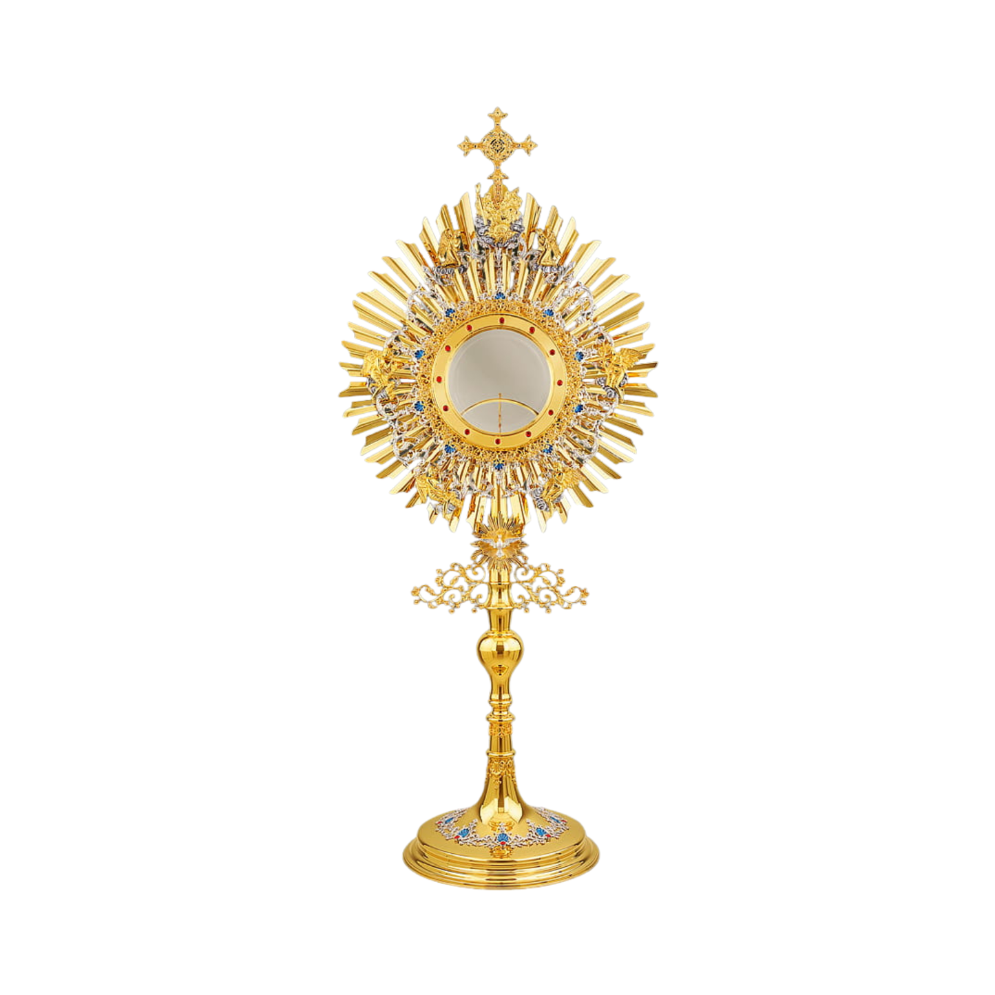 A large monstrance (height: 43-1/4") for a big host (diameter: 6"). Made of brass, 24-karat gold-plated. The glory consists of two sunbursts and two elaborate silver-plated wreaths. The bigger wreath has figures of God the Father and Jesus attached to the top, and six angels placed around the luna case. The smaller wreath is embellished with blue-enameled accents. A figure of the Holy Spirit (the Dove) against its own small sunburst is set at the bottom of the glory. The opening for the luna comes with an o