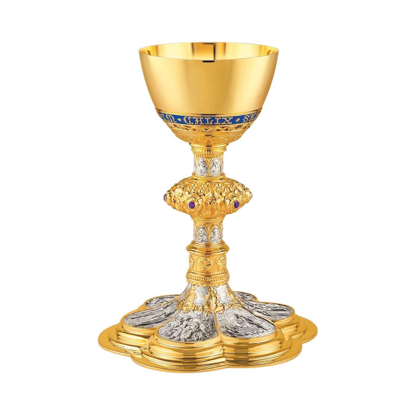 Chalice & Scale Paten in neo-gothic style with scenes from the New
Testament and cup inscription: “HIC EST ENIM CALIX SANGUINIS MEI”
9 5/8” Ht. sold by The Clergy Store