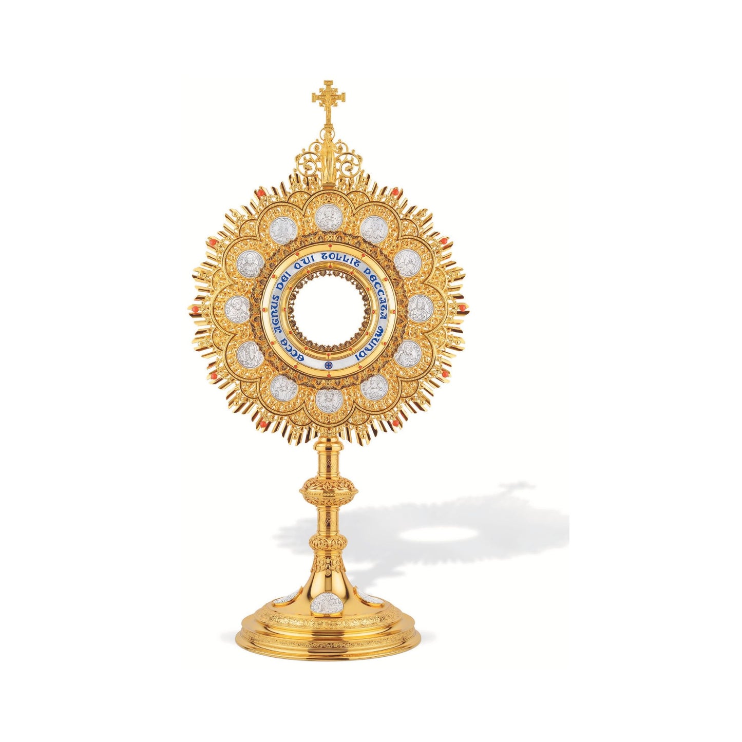 Traditional Monstrance with medallions of the Twelve Apostles and
Latin inscription: “ECCE AGNUS DEI QUI TOLLIT PECCATA MUNDI”;
medallions with scenes from the Bible on base. Made in Poland and sold by The Clergy Store