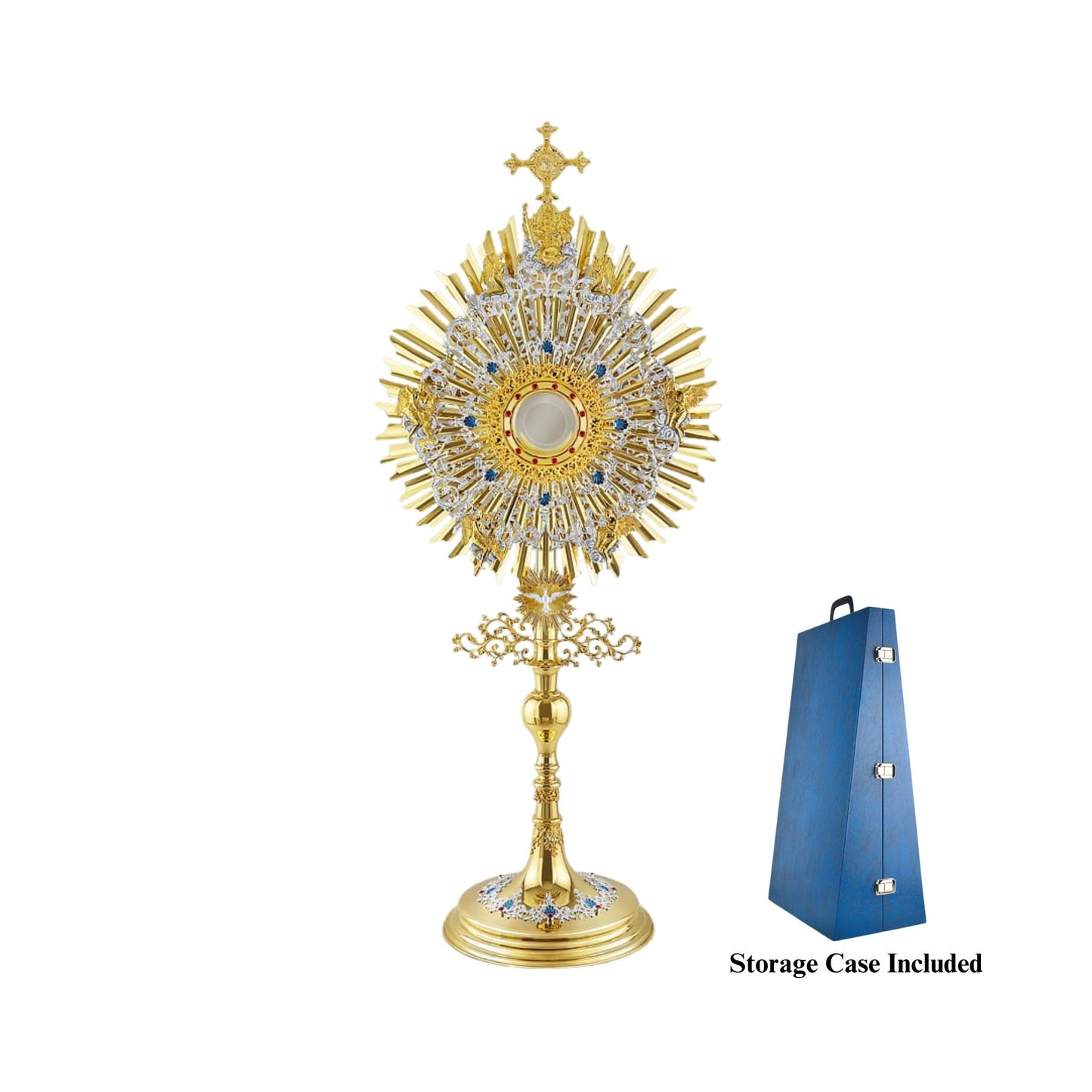 A large monstrance (height: 43-3/4") made of brass, 24-karat gold-plated with silver-plated and blue-enameled accents. The sunburst-shaped glory consists of three layers of rays and two silver-plated wreaths made of ornate floral scrollwork. The bigger wreath is adorned with figures of God the Father and Jesus at the top, and six angels around the luna case. The opening for the luna is gold-rimmed, filigreed and encrusted with synthetic red gemstones. A figure of the Holy Spirit (the Dove) is placed at the