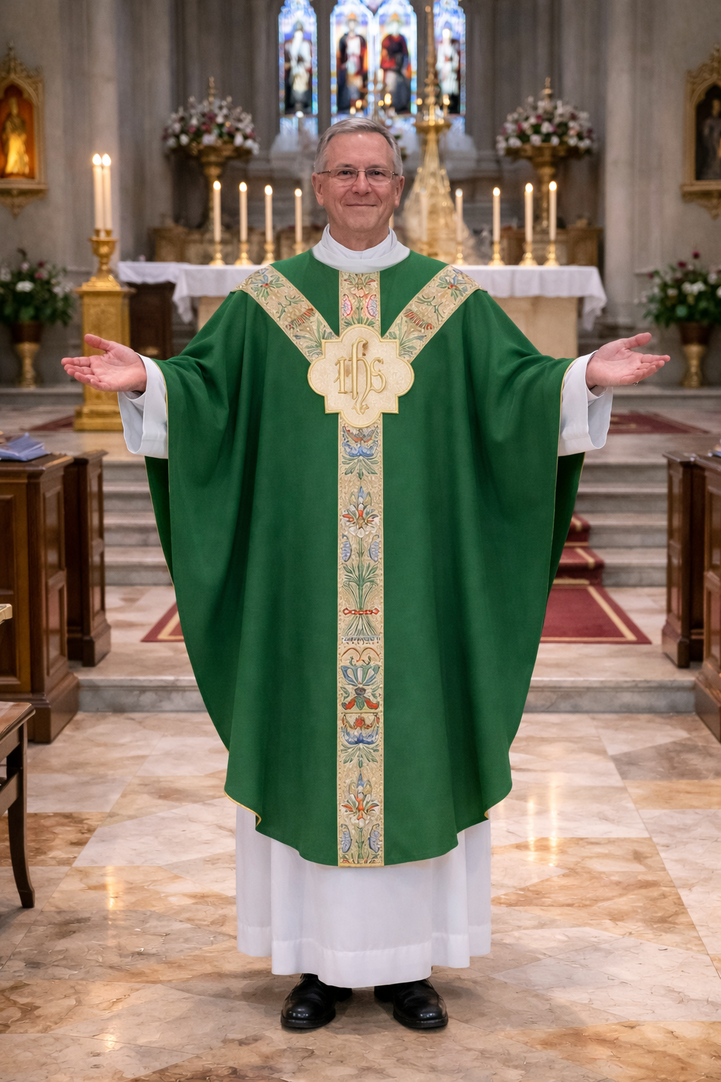 Priest in a green gothic liturgical vestment with IHS embroidery standing in a church.