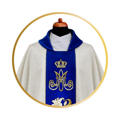 Ava Maria chasuble with embroidered Lilly's on blue velvet orphrey.
