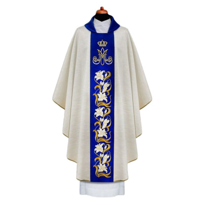 Ava Maria chasuble with embroidered Lilly's on blue velvet orphrey.