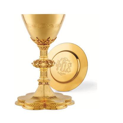 Chalice & Dish Paten in neo-gothic style with scenes from the Old Te
stament and cup inscription:  “HIC  EST  ENIM  CALIX SANGUINIS MEI” 
8 5/8” Ht. sold by The Clergy Store