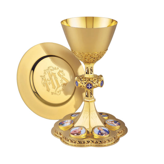 Chalice & Dish Paten in neo-gothic style with medallions of the Four 
Evangelists, the Mother of  God and the Crucifixion,  9 1/4” Ht. Sold by The Clergy Store