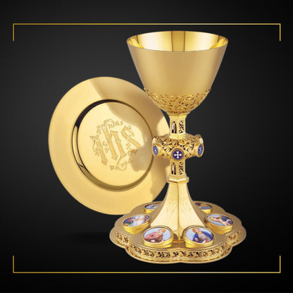  Chalice & Dish Paten in neo-gothic style with medallions of the Four 
Evangelists, the Mother of  God and the Crucifixion,  9 1/4” Ht. Sold by The Clergy Store