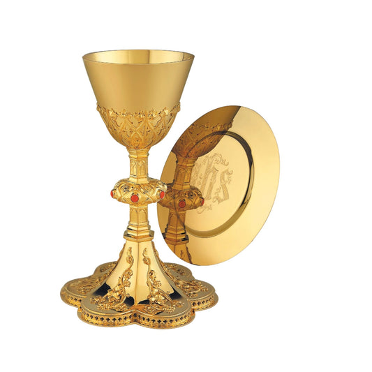 Chalice & Paten in neo-gothic style with elaborate floral design 8 5/8” 
Ht.  Sold by The Clery Store