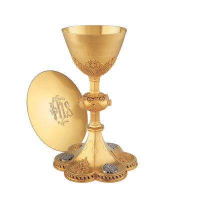 Chalice  &  Scale Paten in neo-gothic style with medallions depicting the Life of Christ and cup inscription: “HIC EST ENIM CALIX SANGUINIS MEI” , 9 5/8” Ht. sold by The Clergy Store