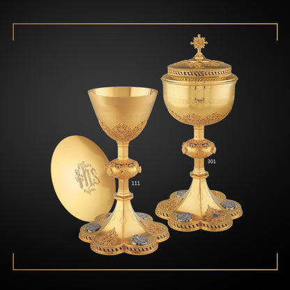 Chalice  &  Ciborium neo-gothic style with medallions depicting the Life of Christ and cup inscription: “HIC EST ENIM CALIX SANGUINIS MEI” , sold by The Clergy Store