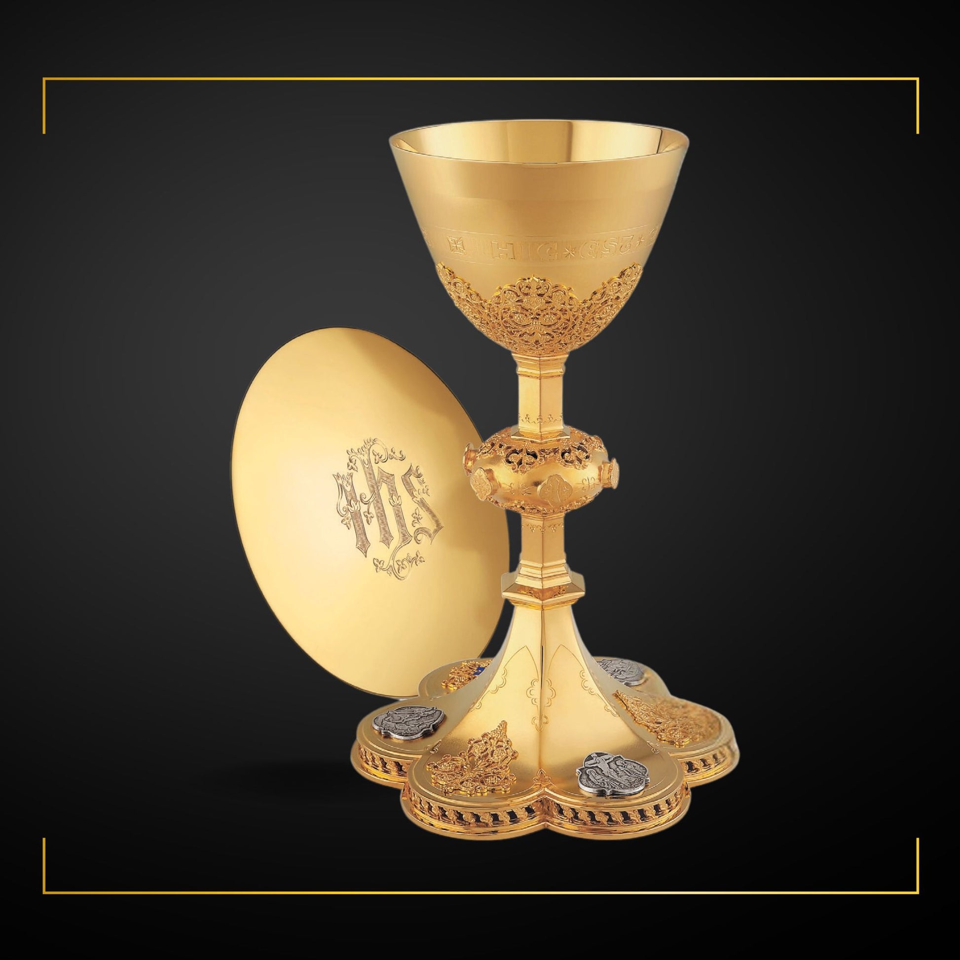 Chalice  &  Scale Paten in neo-gothic style with medallions depicting the Life of Christ and cup inscription: “HIC EST ENIM CALIX SANGUINIS MEI” , 9 5/8” Ht. sold by The Clergy Store