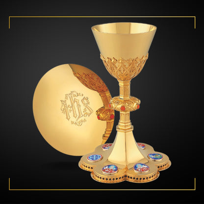 Chalice & Scale Paten in neo-gothic style with enameled medallions 
of Jesus, the Four Evangelists and a cross symbol,  8 5/8” Ht. Sold by The Clergy Store