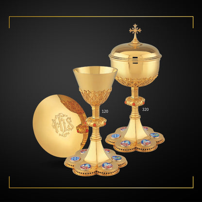 Chalice & Ciborium set in neo-gothic style with enameled medallions of Jesus, the Four Evangelists and a cross symbol. Sold by The Clergy Store