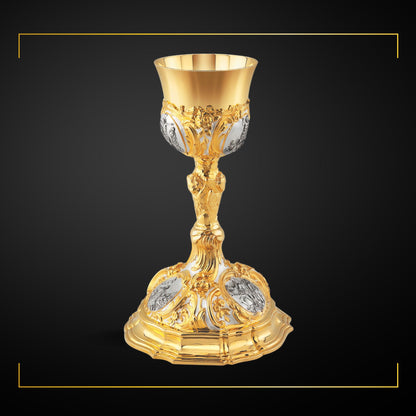 Chalice & Paten in baroque style with images of the Life of Christ,         
11” Ht.  sold by The Clergy Store