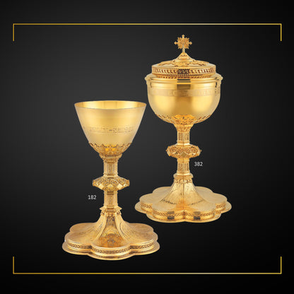 Chalice & Ciboria Set Paten in neo-gothic style with engraved images saints and cup inscription:: “HIC EST ENIM CALIX SANGUINIS MEI” sold by The Clergy Store