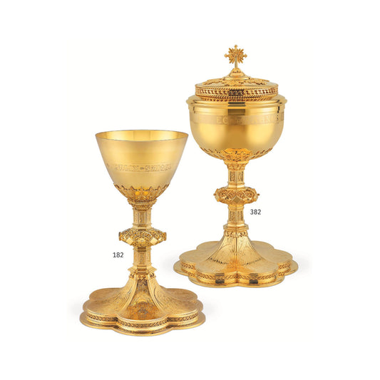 Chalice & Ciborium set in neo-gothic style with engraved images saints and cup inscription: Sold by The Clergy Store