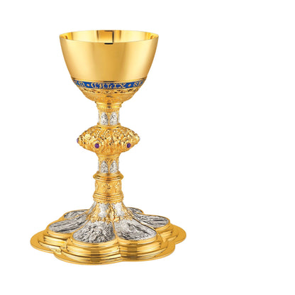 Chalice & Scale Paten in neo-gothic style with scenes from the New 
Testament and cup inscription: “HIC EST ENIM CALIX SANGUINIS MEI” 
9 5/8” Ht. sold by The Clergy Store