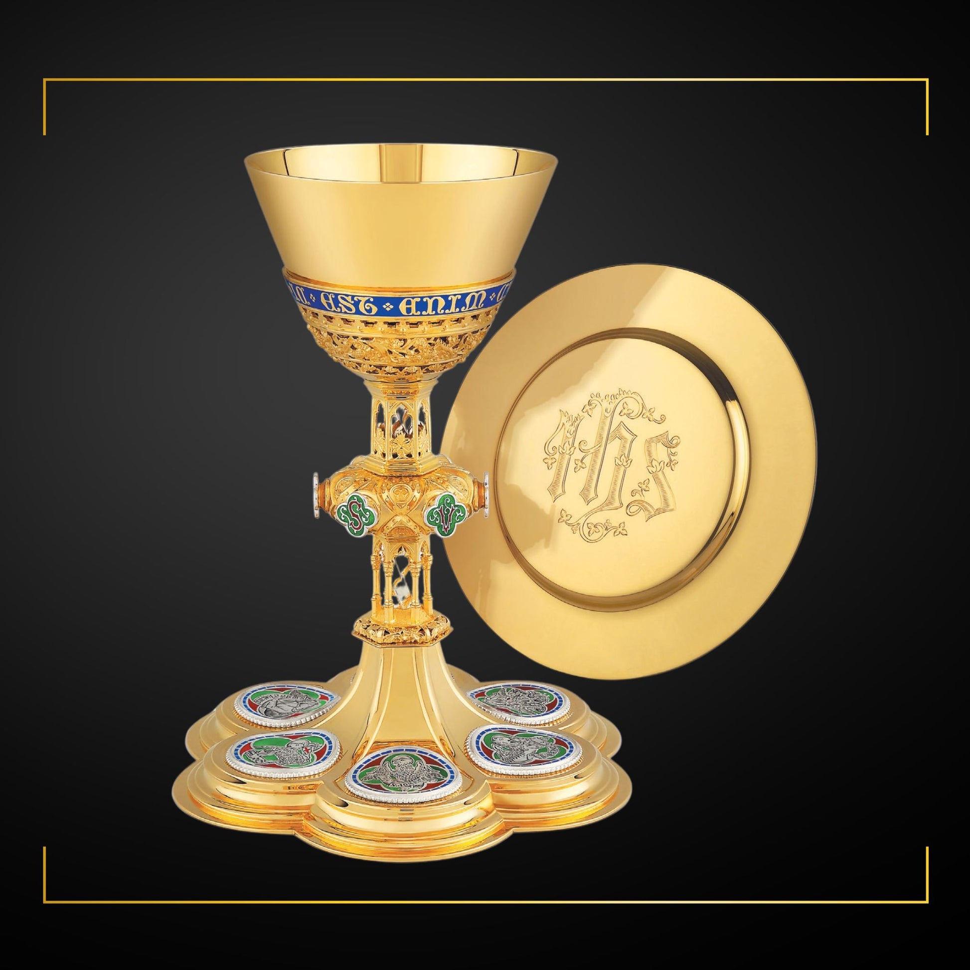 Chalice & Dish Paten in neo-gothic style with medallions depicting 
symbols of Christ and of the Four Evangelists, and cup inscription: “HIC EST ENIM CALIX SANGUINIS MEI” , 8 7/8” Ht. sold by The Clergy Store