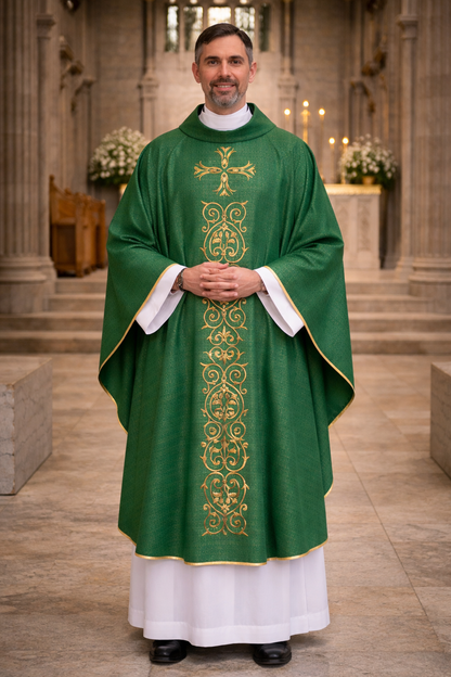 Priest in a green and gold liturgical vestment standing in a church interior.