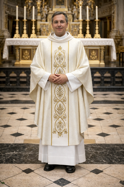Priest in ornate white and gold vestment standing in a church.
