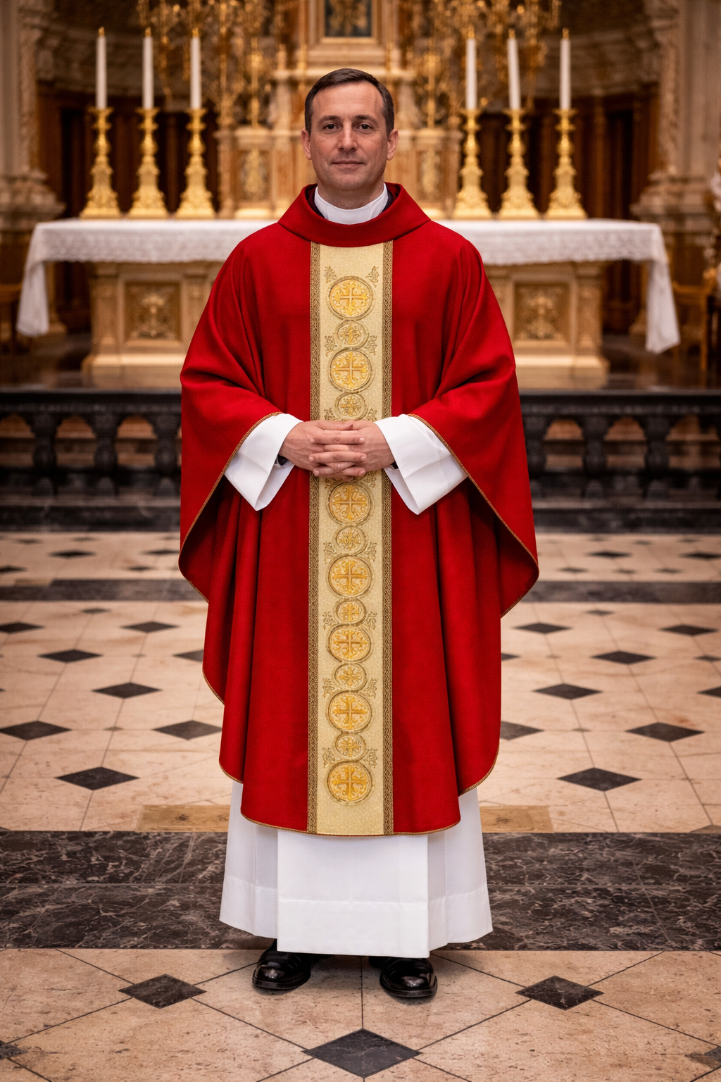 Priest in red vestment with gold stole standing in a church.