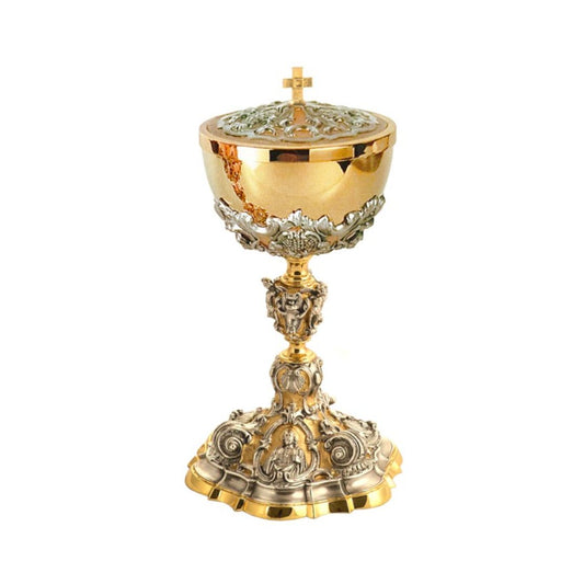 Ciborium in two tone finish with image of Jesus, Joseph, and Mary in a gold plated finish.
