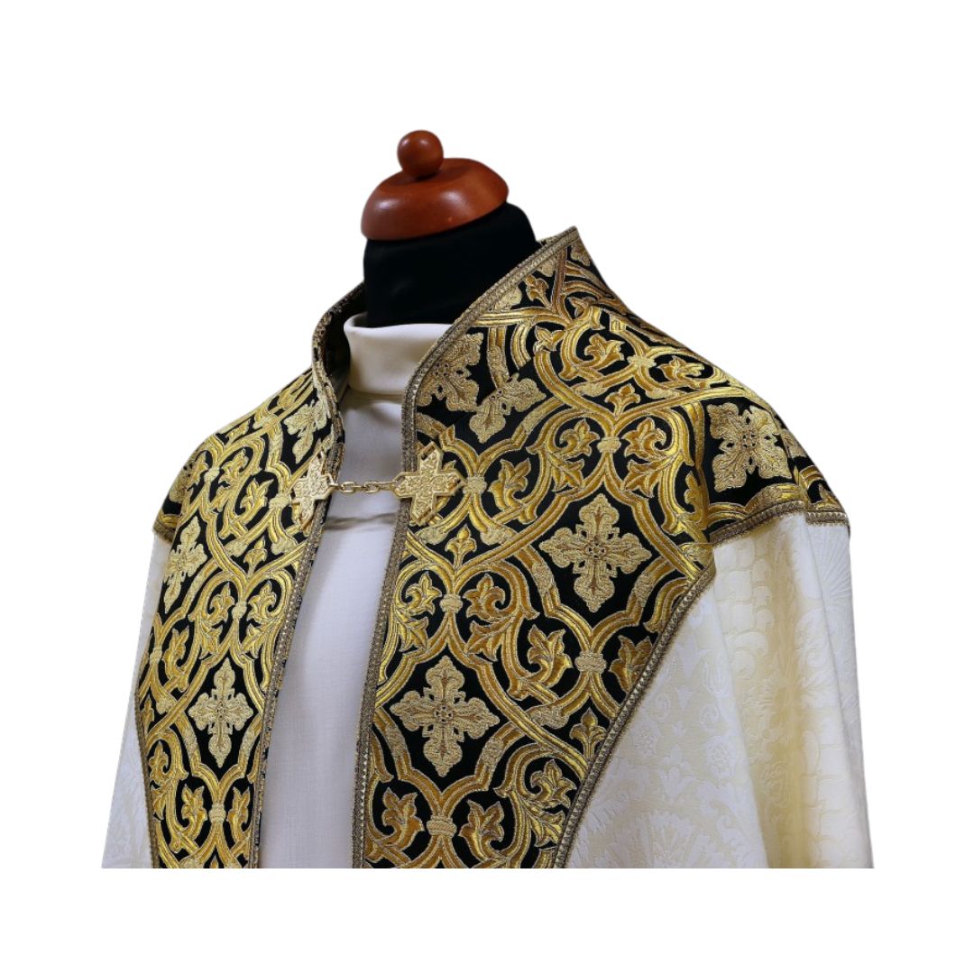 Liturgical cope made with black and gold brocade on ivory damask. Made in Poland and sold by The Clergy Store