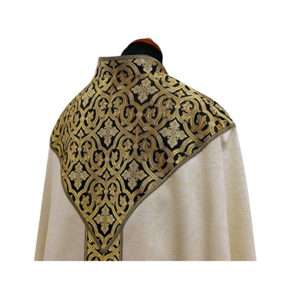 Liturgical cope made with black and gold brocade on ivory damask. Made in Poland and sold by The Clergy Store