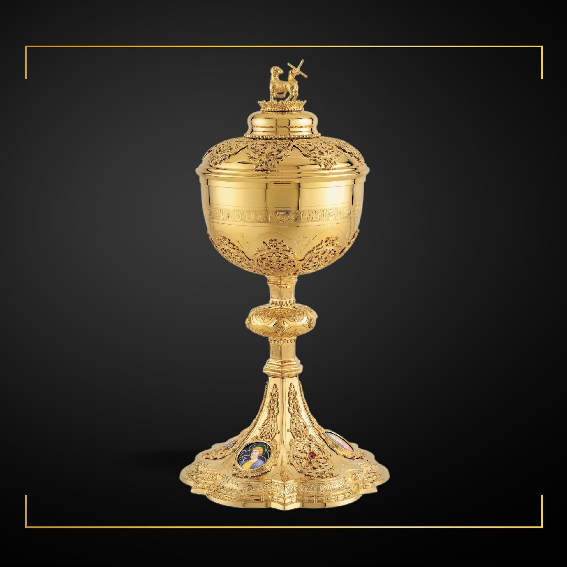 Ciborium in neo-gothic style with enameled medallions of the Holy Family and cup inscription: “ECCE AGNUS DEI QUI TOLLIT PECCATA MUNDI” , 11 1/2” Ht. , 200 Hosts. Sold by The Clergy Store