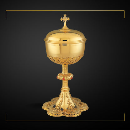 Ciborium in neo-gothic style with elaborate floral design 8 5/8” 
Ht. Sold by The Clergy Store