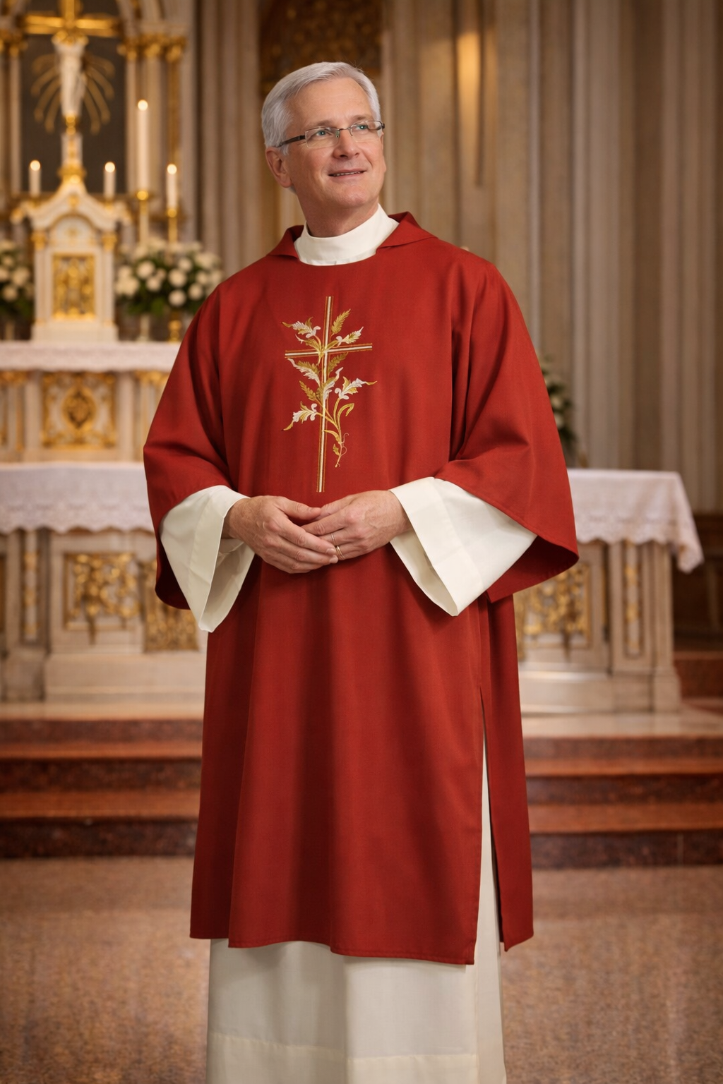 Deacon in red vestment with embroidered design standing in a church setting.