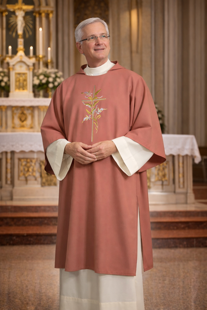Deacon in rose vestment with embroidered design standing in a church setting.