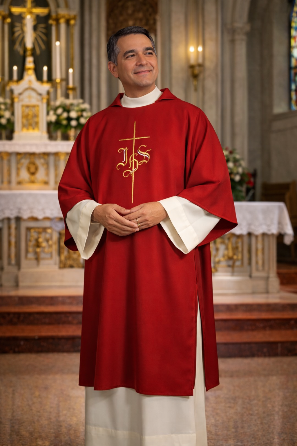 Deacon in red liturgical vestment with 'IHS' symbol in a church setting