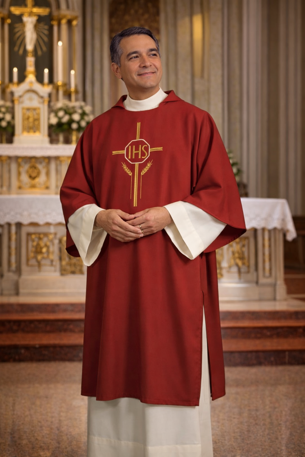 Deacon in red liturgical vestment with IHS symbol in a church setting