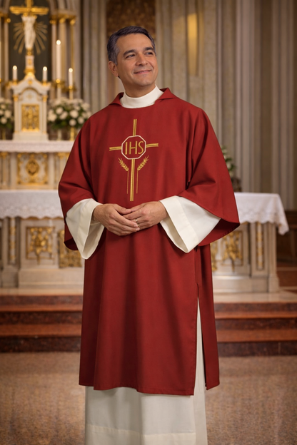 Deacon in red liturgical vestment with IHS symbol in a church setting