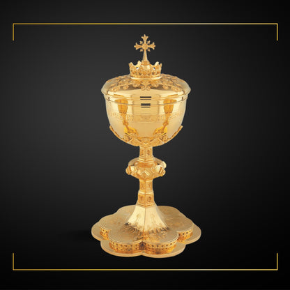 Ciborium in neo-gothic style with engraved images of the Holy Family and cup inscription: “ECCE AGNUS DEI QUI TOLLIT  PECCATA  MUNDI”  sold by The Clergy Store