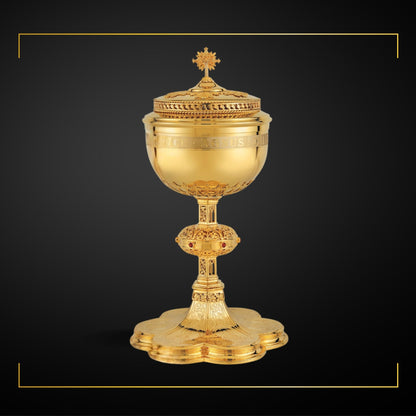 Ciborium neo-gothic style with engraved images of the Crucifixion, the Mother of God and saints: Peter, Paul, John and Joseph,&nbsp; with cup inscription: “ECCE AGNUS DEI QUI TOLLIT PECCATA MUNDI” Sold by The Clergy Store