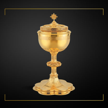 Ciborium in neo-gothic style with engraved images saints and 
cup inscription: “ECCE AGNUS DEI QUI TOLLIT PECCATA MUNDI” , 11 1/4” Ht. , 200  Hosts The Clergy Store