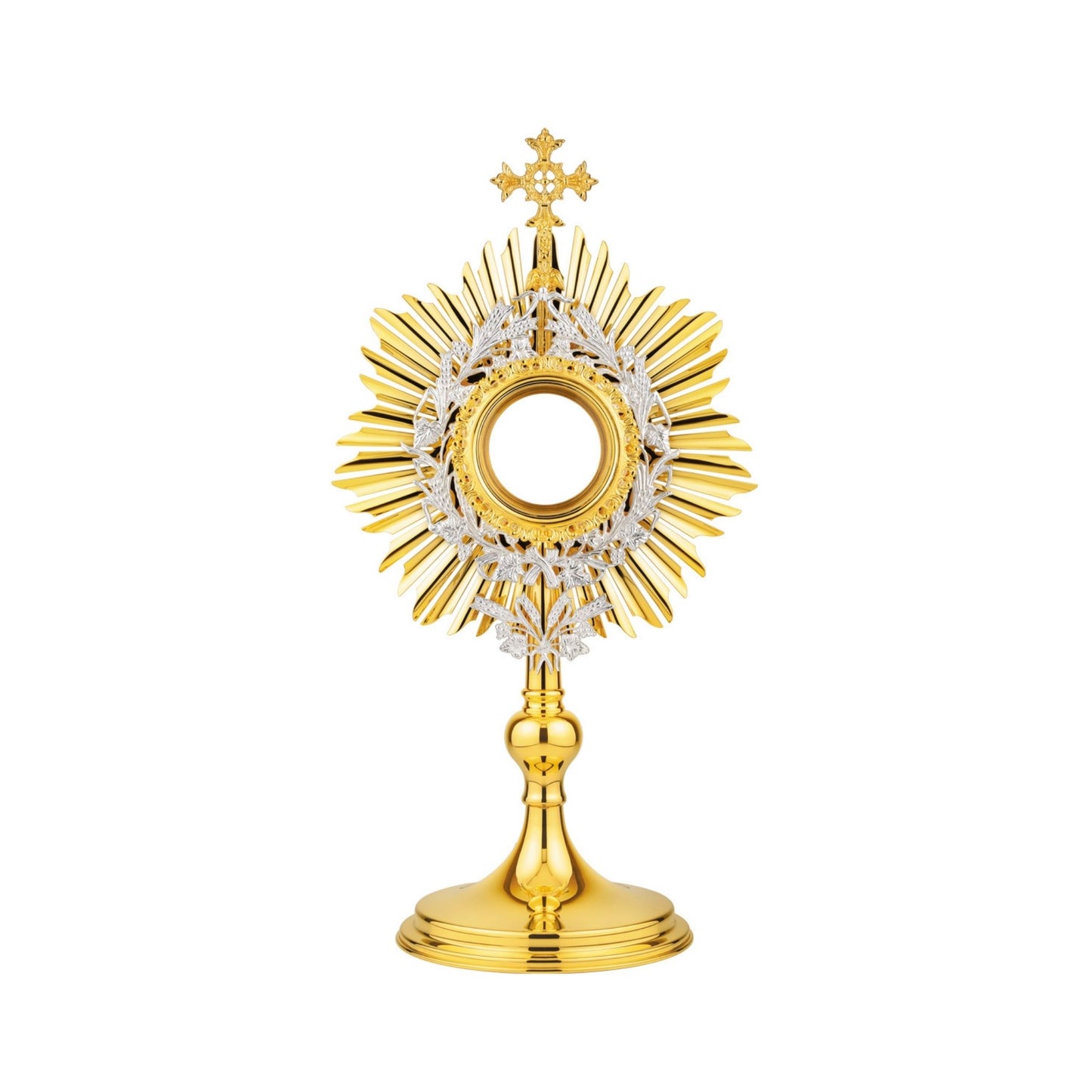 Brass monstrance in traditional style, 24-karat gold plated with silver-plated accents. The sunburst is topped with a decorative cross. Gold-rimmed luna case is surrounded by a silver-plated wreath of wheat and grapevine leaves. An ornament shaped as a bouquet of wheat is attached to the bottom of the glory. The design of this monstrance makes it suitable for use in both historical and modern interiors.