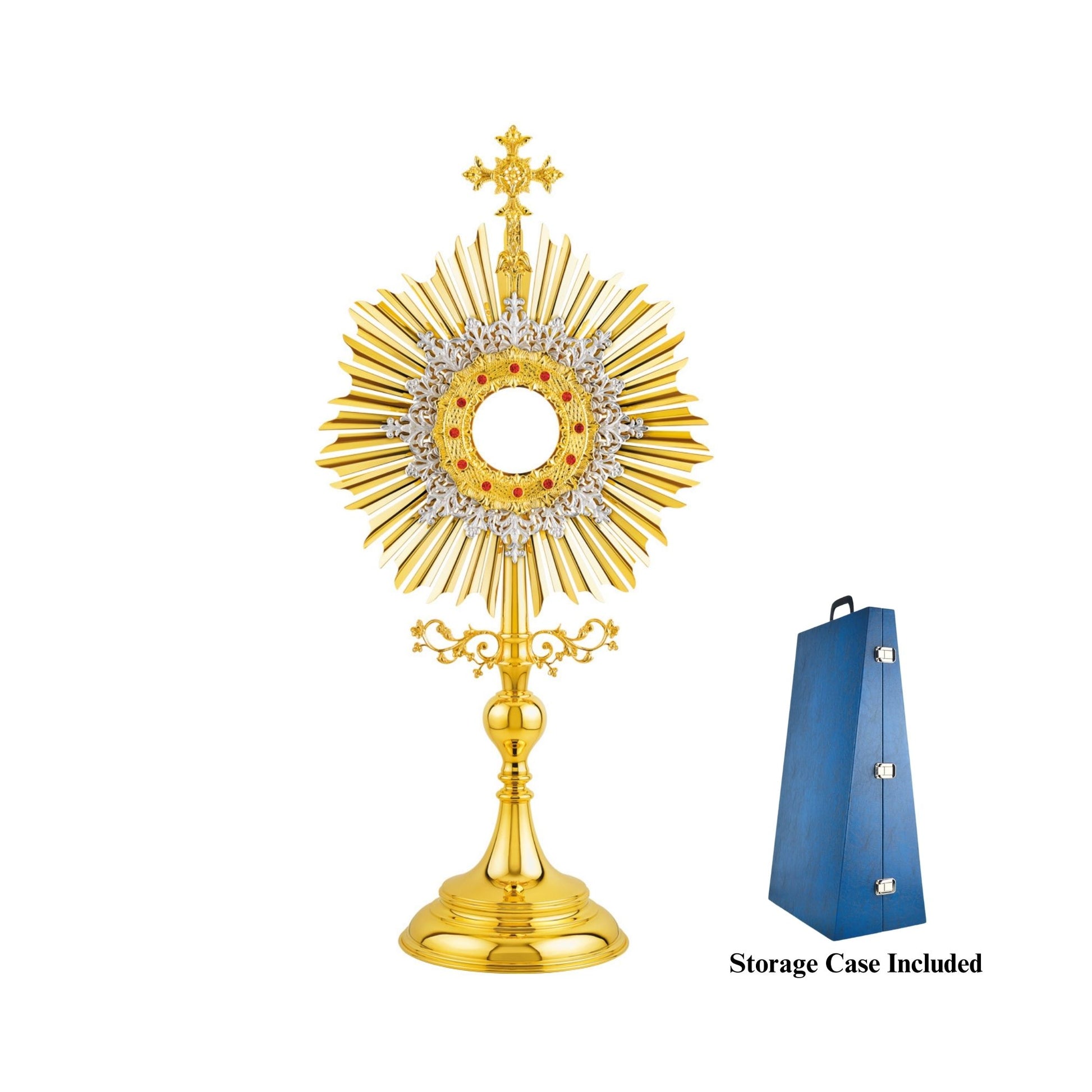 Traditional, sun-shaped monstrance made of brass, 24-karat gold-plated. The luna case is surrounded by a silver-plated floral wreath and a round decorative frame set with red stones. At the top of the monstrance there is a big cross with sculpted ornaments. The node and the base are finished in high gloss.