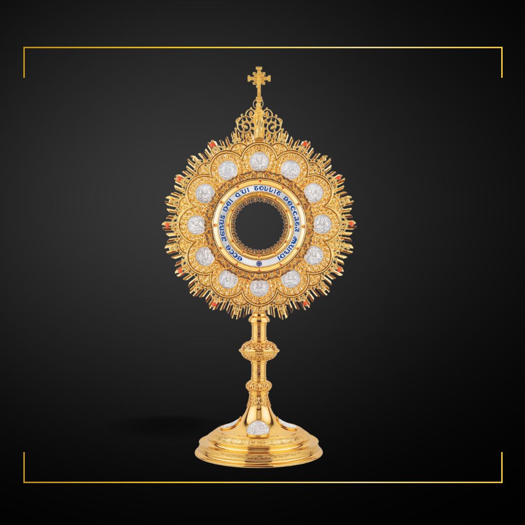 Traditional Monstrance with medallions of the Twelve Apostles and 
Latin inscription: “ECCE AGNUS DEI QUI TOLLIT PECCATA MUNDI”; 
medallions with scenes from the Bible on base. Made in Poland and sold by The Clergy Store