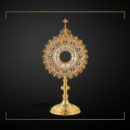 Traditional Monstrance with Medallions of the Twelve Apostles and Latin inscription: "ECCE AGNUS DEI QUI TOLLIT PECCATA MUNDI" Medallions with scenes from the Bible on the base. Made in Poland and sold by The Clergy Store