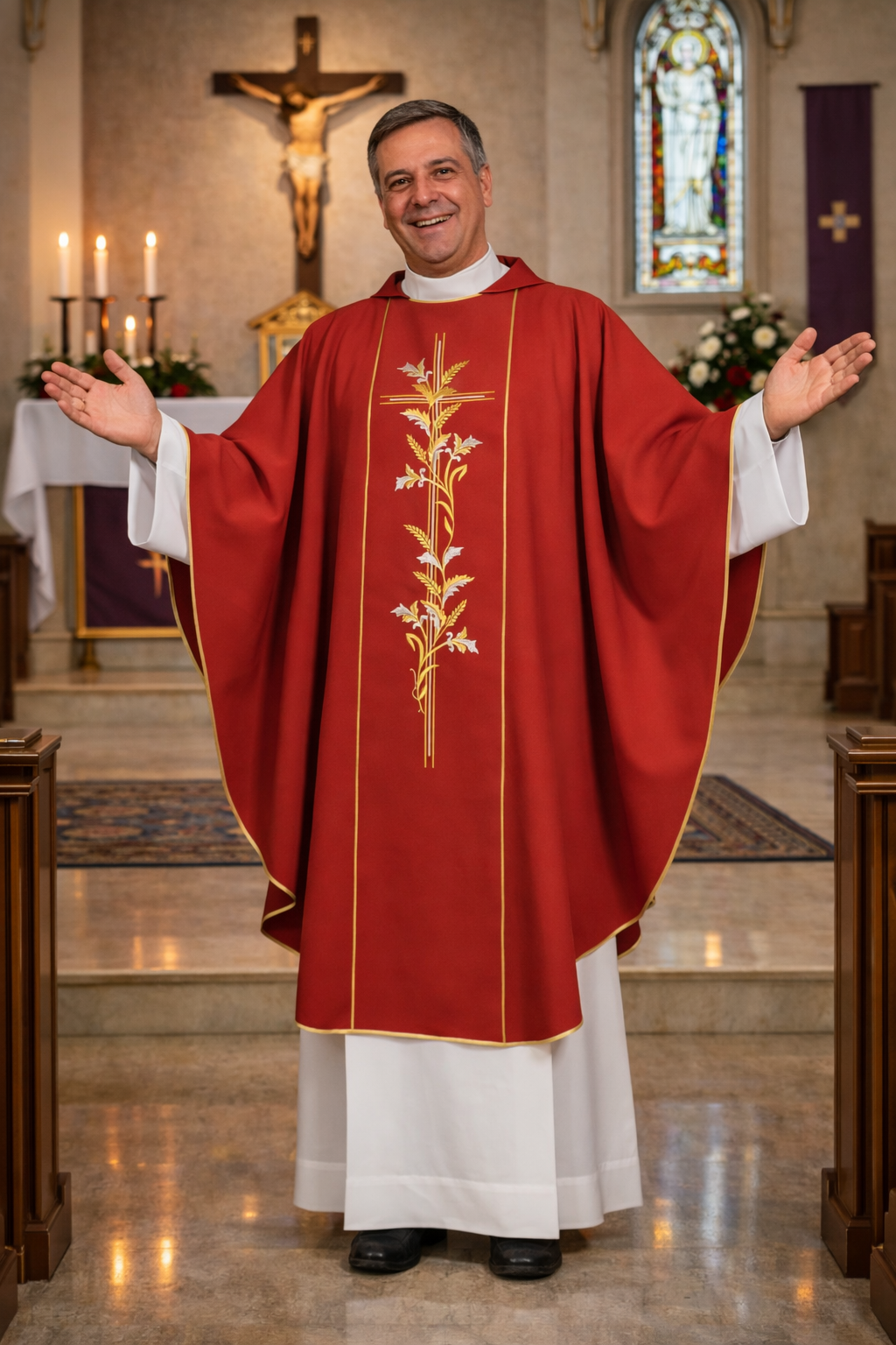 Priest in red liturgical vestment standing in a church with stained glass window and crucifix in the background.