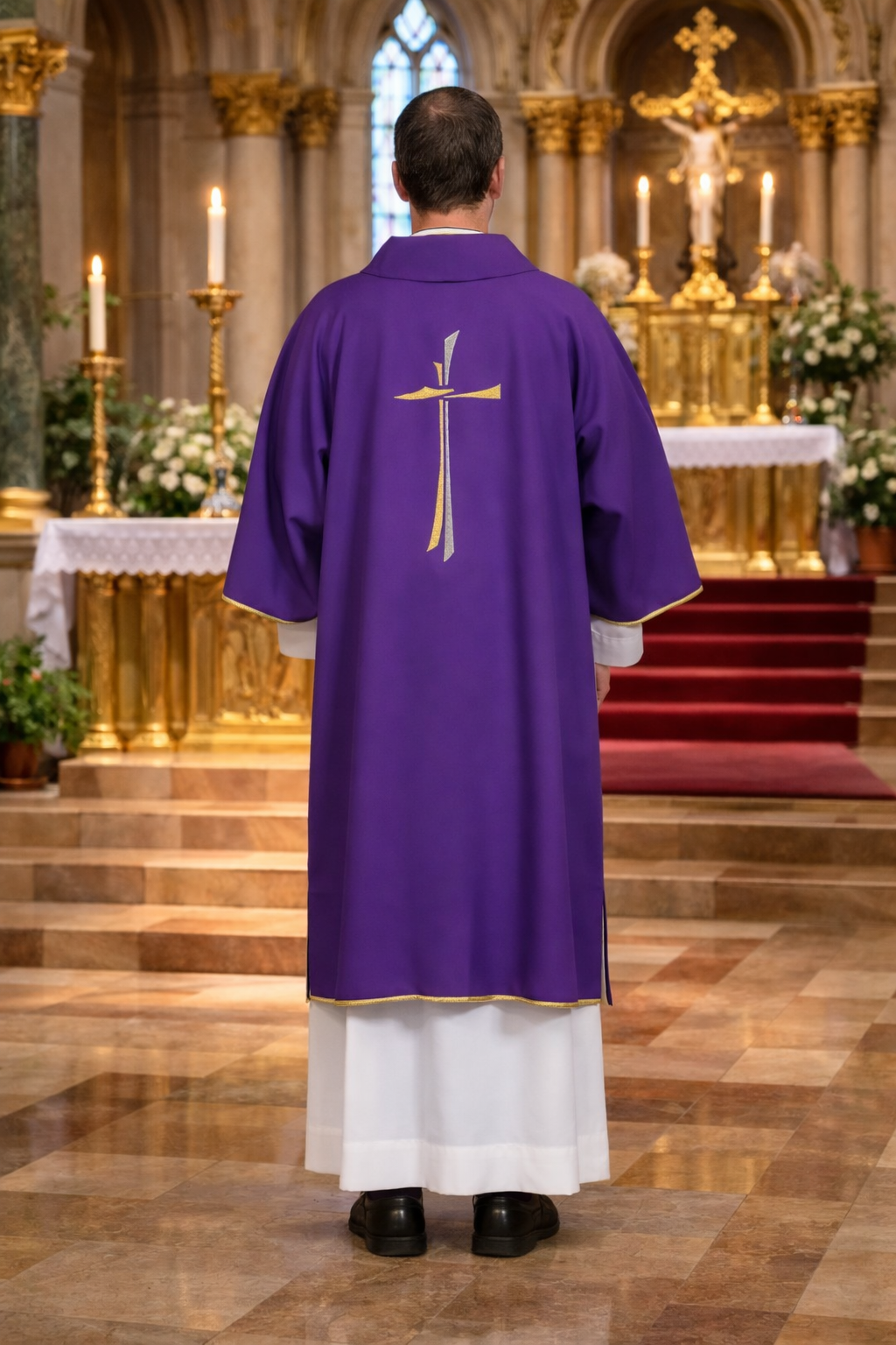 Deacon in purple dalmatic standing in a cathedral with altar and crucifix in the background.