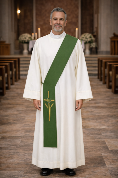 Deacon in white alb with green cross stole standing in a church.