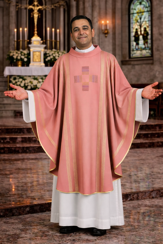 Priest in pink liturgical vestments standing in a church setting.