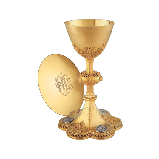 Chalice  &  Scale Paten in neo-gothic style with medallions depicting the Life of Christ and cup inscription: “HIC EST ENIM CALIX SANGUINIS MEI” , 9 5/8” Ht. sold by The Clergy Store