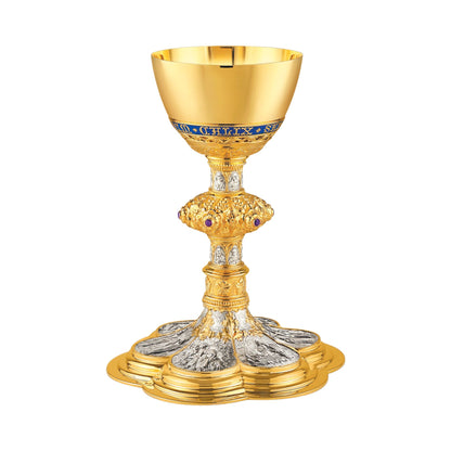 Chalice & Scale Paten in neo-gothic style with scenes from the New 
Testament and cup inscription: “HIC EST ENIM CALIX SANGUINIS MEI” 
9 5/8” Ht. sold by The Clergy Store